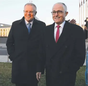  ?? Picture: KYM SMITH ?? SALES PITCH: Treasurer Scott Morrison and Prime Minister Malcolm Turnbull outside Parliament House in Canberra yesterday.