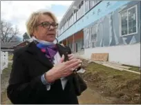  ?? PETE BANNAN — DIGITAL FIRST MEDIA ?? Devon Horse Show volunteer Karin Maynard talks about improvemen­ts to the Devon Horse Show grounds, including the new events pavilion and offices seen in the background.