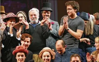  ?? PHOTOS BY SARA KRULWICH/THE NEW YORK TIMES ?? Songwriter Stephen Sondheim (center left) leads the crew and cast in a round of applause at a final dress rehearsal for “Sunday in the Park with George” on Jan. 24, 2008, at Studio 54 in New York. Sondheim’s music and lyrics raised the standard for the American musical.