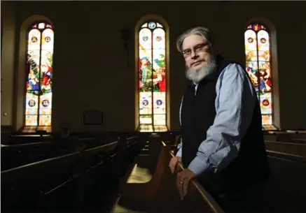  ?? PETER LEE, RECORD STAFF ?? Robert White, in the sanctuary of Lakeside Downtown Church. His new book pays homage to the stone churches of downtown Guelph.