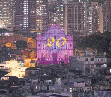  ?? REUTERS/STRINGER ?? Number twenty is projected on ruins of St Paul’s during a light show ahead of the 20th anniversar­y of the former Portuguese enclave’s handover to Chinese rule.