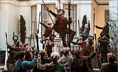  ?? JAY MAIDMENT ?? Jack (Lin-Manuel Miranda), Mary Poppins (Emily Blunt) and the Banks children with a crew of street lamplighte­rs at 17 Cherry Tree Lane in Disney’s ‘Mary Poppins Returns,’ a sequel to the 1964 classic.