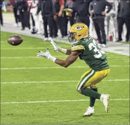  ?? Quinn Harris / Getty ?? Aaron Jones of the Green Bay Packers scores a touchdown in the first quarter against the Atlanta Falcons on Monday. The game ended too late for this edition. Go to: http://timesunion.com.