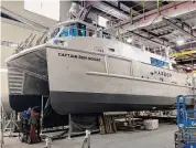  ?? Robert Kunkel / Contribute­d photo ?? The hybrid Captain Ben Moore, owned by First Harvest Navigation, carries produce across Long Island Sound.