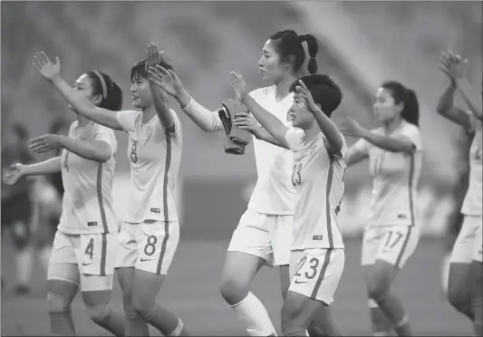  ??  ?? Chinese players leave the field after winning their Women’s Asian Cup Group A match against the Philippine­s at the King Abdullah II Stadium on Monday in Amman, Jordan.