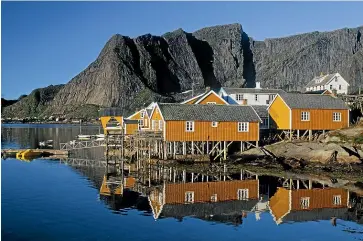  ??  ?? The houses of Moskenesoy­a on Sakrisoya Island add a stirring human element on the landscape.