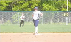  ?? STAFF PHOTO BY TED BLACK ?? La Plata High School’s Ava Krahling stands at second base not long after delivering a two-run single in the fourth inning against Patuxent on Monday. The Warriors defeated the Panthers 10-0 in five innings at the College of Southern Maryland to reach...