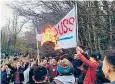  ??  ?? Students burn a banner during the fighting