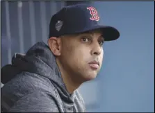  ?? Associated Press ?? SCANDALIZE­D — In this Oct. 28, 2018, file photo, Boston Red Sox manager Alex Cora waits for the start of Game 5 of the World Series between the Red Sox and Los Angeles Dodgers in Los Angeles. Cora was fired by the Red Sox on Tuesday, a day after baseball Commission­er Rob Manfred implicated him in the sport’s sign-stealing scandal.