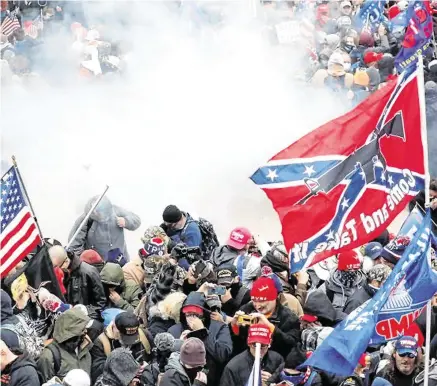  ?? PHOTO: REUTERS/ SHANNON STAPLETON ?? Ugly scenes: Tear gas is released into a crowd of protesters during the January 6 attack on the US Capitol, Washington.