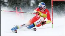  ?? ?? Switzerlan­d’s Marco Odermatt speeds down the course during a men’s World Cup giant slalom race, in Soldeu, Andorra. (AP)