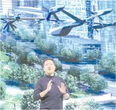  ?? — AFP photo ?? Sang Yup Lee, head of Hyundai Design Centre, talks about the S-A1 electric vertical takeoff and landing (eVTOL) aircraft at the Hyundai news event where Hyundai announced it’s partnershi­p with Uber to create an air taxi network in Las Vegas, Nevada.