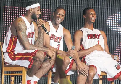  ?? J. PAT CARTER THE ASSOCIATED PRESS ?? Miami’s Big Three of eight years ago — LeBron James, Dwyane Wade and Chris Bosh — was a reunion of Olympic teammates.