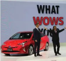  ??  ?? Miami Marlins’ outfielder Ichiro Suzuki, left, joined Toyota president Akio Toyoda to unveil the 2016 Toyota Prius at the Tokyo Motor Show.