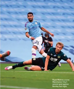  ??  ?? Riyad Mahrez scores Manchester City’s second goal against Burnley last night