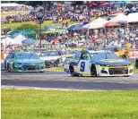  ?? JEFFREY PHELPS/ASSOCIATES PRESS ?? Chase Elliott (9) leads a group through one of the turns of Sunday afternoon’s road-course race in Elkhart Lake, Wisconsin.