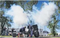  ?? PHOTO: GERARD O’BRIEN ?? Tradition . . . Smoke from a QF 25pounder field gun obscures the elms at Queens Gardens after the howitzer was fired to commemorat­e Armistice Day in Dunedin yesterday morning.