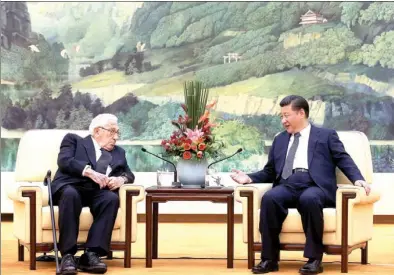  ?? XU JINGXING / CHINA DAILY ?? Presiden XI Jinping meets with former US secretary of state Henry Kissinger in the Great Hall of the People in Beijing on Friday. Xi called Kissinger’s visit timely, as bilateral relations face a period of transition.