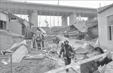  ?? XU SUHUI / XINHUA ?? Firefighte­rs attend the site of an explosion that occurred at a plant in Jinan, Shandong province, on Tuesday. The incident temporaril­y affected trains on a nearby railway circuit.