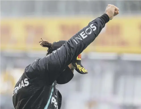  ??  ?? 2 Lewis Hamilton performs a Black Power salute on the podium after winning the Styrian GP. The British driver cruised to his 85th F1 victory with a dominant drive at Spielberg’s Red Bull Ring.