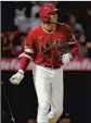  ?? Ashley Landis Associated Press ?? THE ANGELS’ Shohei Ohtani watches his homer in the sixth inning.