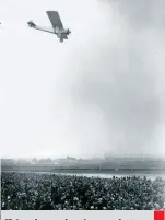  ??  ?? Flying above welcoming crowds at Croydon aerodrome in South London, following his transatlan­tic crossing