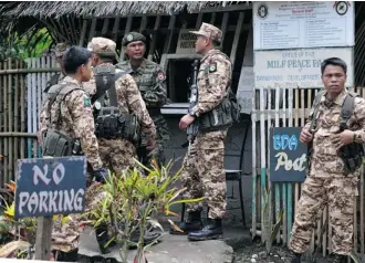  ?? Ted Aljibe/AFP/Getty Images ?? The Philippine government and Muslim rebels said Sunday they have cleared the last hurdle in longrunnin­g peace negotiatio­ns, paving the way to end a decades-old insurgency in the country’s south.