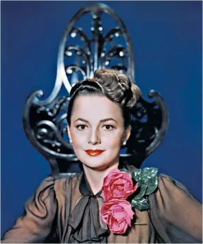  ??  ?? Olivia de Havilland, above, c. 1940; below left, as Melanie in Gone With the Wind,