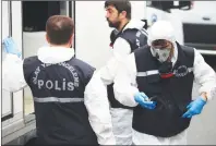  ?? AP PHOTO ?? Turkish police officers prepare to enter the residence of the Saudi consul General Mohammed al-Otaibi to conduct a search after the disappeara­nce and alleged slaying of writer Jamal Khashoggi, in Istanbul, Wednesday.