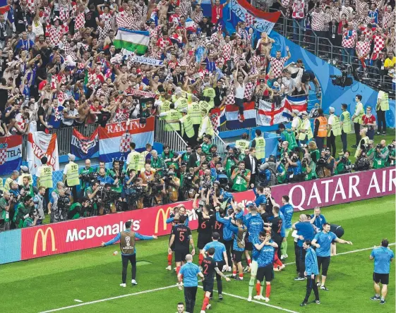  ?? Picture: AFP ?? Croatia's players celebrate with supporters after winning their World Cup semi-final against England in Moscow.