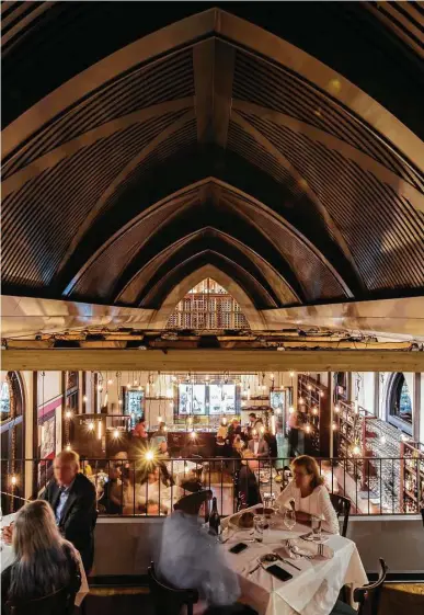  ?? Julie Soefer ?? The dining room buzzes at One Fifth Steak, James Beard Award-winning Chris Shepherd’s reimaginin­g of a steakhouse. Housed in a 1920s church, One Fifth will be open through July and then morph into another concept.