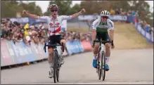  ?? (Special to the NWA Democrat-Gazette/Kai Caddy) ?? Eli Iserbyt of Belgium (left) celebrates at the finish line after outracing Laurens Sweeck to finish first in the elite men’s sprint at the UCI Cyclocross World Cup Fayettevil­le. “I had to really dig really deep,” Iserbyt said. “For me, it was the perfect sprint.”