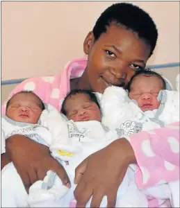  ?? Picture: ABONGILE SOLUNDWANA ?? TRIPLE THE JOY: Dunyiswa Makhonxa shares a cuddle with her three little girls born at Frontier Hospital in Komani last week