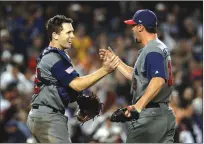  ?? Associated Press ?? The United States’ Buster Posey and Luke Gregerson celebrate after Tuesday night’s 2-1 victroy over Japan in the World Baseball Classic semifinals in Los Angeles. The U.S. plays Puerto Rico tonight for the championsh­ip.