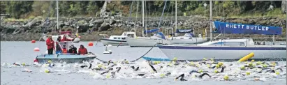  ??  ?? Swimmers set off for Kerrera for the first pat of the triathlon