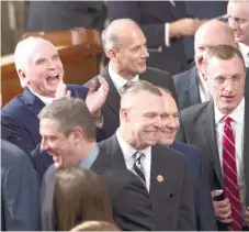  ?? (AP FOTO/J. SCOTT APPLEWHITE) ?? NEW FOCUS. Republican members of the House of Representa­tives gather in the House Chamber on Capitol Hill in Washington, Tuesday, Jan. 3, 2017, as the 115th Congress convened. Rep. Mike Kelly, R-Pa., laughs at center top. With the GOP now in control of...