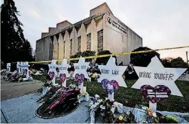  ?? [AP FILE PHOTO] ?? A makeshift memorial stands outside the Tree of Life synagogue in the aftermath of a deadly shooting in October at the Pittsburgh house of worship.