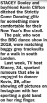  ?? ?? STACEY Dooley and boyfriend Kevin Clifton ditched the Strictly Come Dancing glitz for something more comfortabl­e for their New Year’s Eve stroll.
The pair, who won the BBC dance show in 2018, wore matching baggy grey tracksuits for a walk in south London.
Last week, TV host Stacey, 34, sparked rumours that she is engaged to dancer Kevin, 39, after showing off pictures on Instagram with her sporting a gold band on her ring finger.