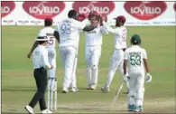  ?? (AFP) ?? West Indies’ Rakheem Caronwall (No. 93), who claimed five wickets, celebrates the dismissal of Bangladesh’s Nayeem Hasan on the third day of the second Test at the Sher-e-Bangla National Cricket Stadium in Dhaka on Saturday.