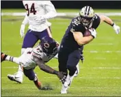  ?? Butch Dill Associated Press ?? THE SAINTS’ Michael Burton moves downfield as the Bears’ Danny Trevathan goes for the tackle.