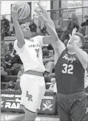  ?? Scott Herpst, file ?? Lafayette’s Decameron Porter battles against Heritage’s Kobe Mcallister during last season’s region tournament. Now a senior, Porter will be looking to help lead the Ramblers to what they hope will be another deep playoff run this season.