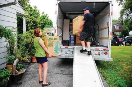  ?? Chris Dunn / Associated Press ?? Moving to a new place can be taxing, emotionall­y and financiall­y, but preparing a budget can help. By mentally walking through your moving process, you can find the cheapest options.