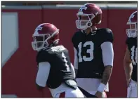  ?? (NWA Democrat-Gazette/Andy Shupe) ?? Graduate transfer Feleipe Franks (13) will work with the first-team offense in today’s scrimmage, coaches said, while redshirt freshman KJ Jefferson (1) will be with the second unit.