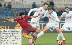  ?? — Reuters ?? AS Roma’s Mohamed Salah (left) fights for the ball with Chievo Verona’s Nicola Rigoni (right) and Dario Dainelli.