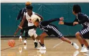  ?? Jason Fochtman ?? The Woodlands guard KeSean Carter (12) dribbles the ball after forcing a turnover as Willis guard D’Shawn Woods (13) attempts to deflect the ball during the first quarter of a high school boys basketball game at The Woodlands High School, Tuesday, in The Woodlands.