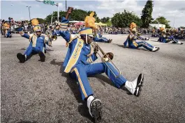  ?? BRYAN CEREIJO Miami Herald file, 2020 ?? Members of the Northweste­rn High School band perform at the annual Martin Luther King Jr. Day parade in Liberty City.