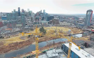  ?? RJ Sangosti, The Denver Post ?? Cranes tower over the new Riverview building in this file photo from March 2018 when the building was under constructi­on in the 1700 block of Platte Street. Denver's skyline has continued to change as the city’s population booms.