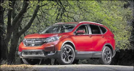  ??  ?? Honda says its CR-V, one of the best-selling SUVs in the U.S., will come with an optional turbocharg­ed engine that will get best-in-class fuel economy.