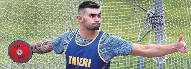  ??  ?? Total concentrat­ion . . . Jade Zaia (20) looks to hurl the discus at the Otago athletics championsh­ips at the Caledonian Ground on Saturday.