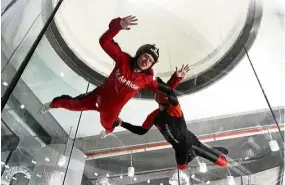  ??  ?? The writer flying towards the top of the tunnel with his instructor.